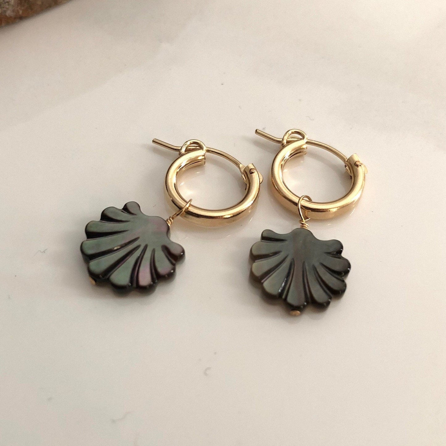 Tiny black shell hoop earrings